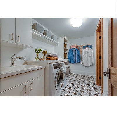 Fold down wall mounted clothes drying rack made of maple hardwood with clothes drying on it