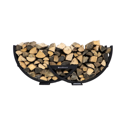 Winter Workman firewood rack by The Woodhaven showing curved steel design and wood storage