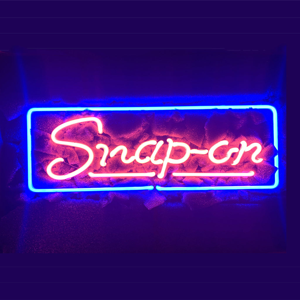 Snap_on Neon Light Sign glowing neon tubes on acrylic backing hanging on wall