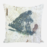 Square pillow with abstract dark blue and gray fish head design on a light textured background with scattered thin lines and brown shapes.