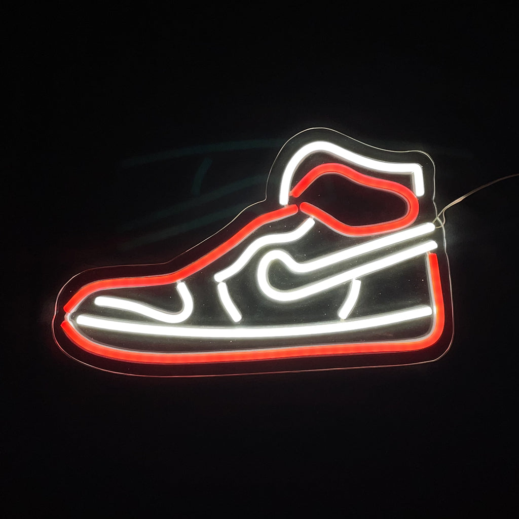 Red Sneaker LED Neon Light showing glowing red sneaker shape on an acrylic backing hanging indoors