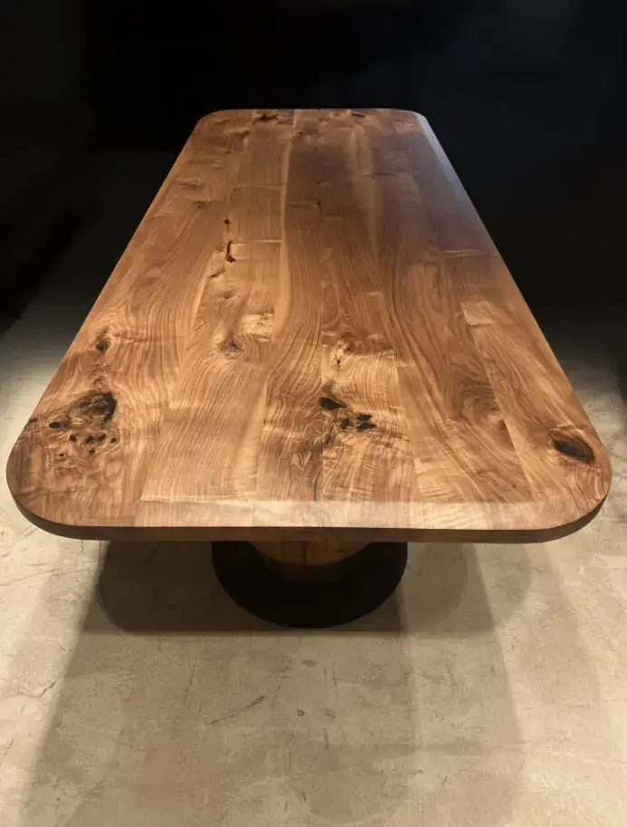 Solid walnut wood dining table with edge-glued tabletop and wooden tulip legs