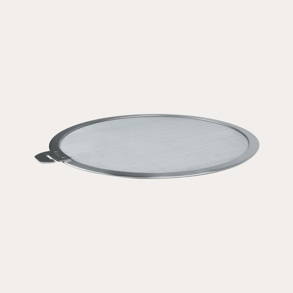CRISTEL USA stainless steel splatter screen with brushed finish on stove