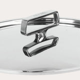 Polished stainless steel pot lid with a double rectangular handle and embossed CRISTEL branding on the upper handle, shown in close-up on a light background.