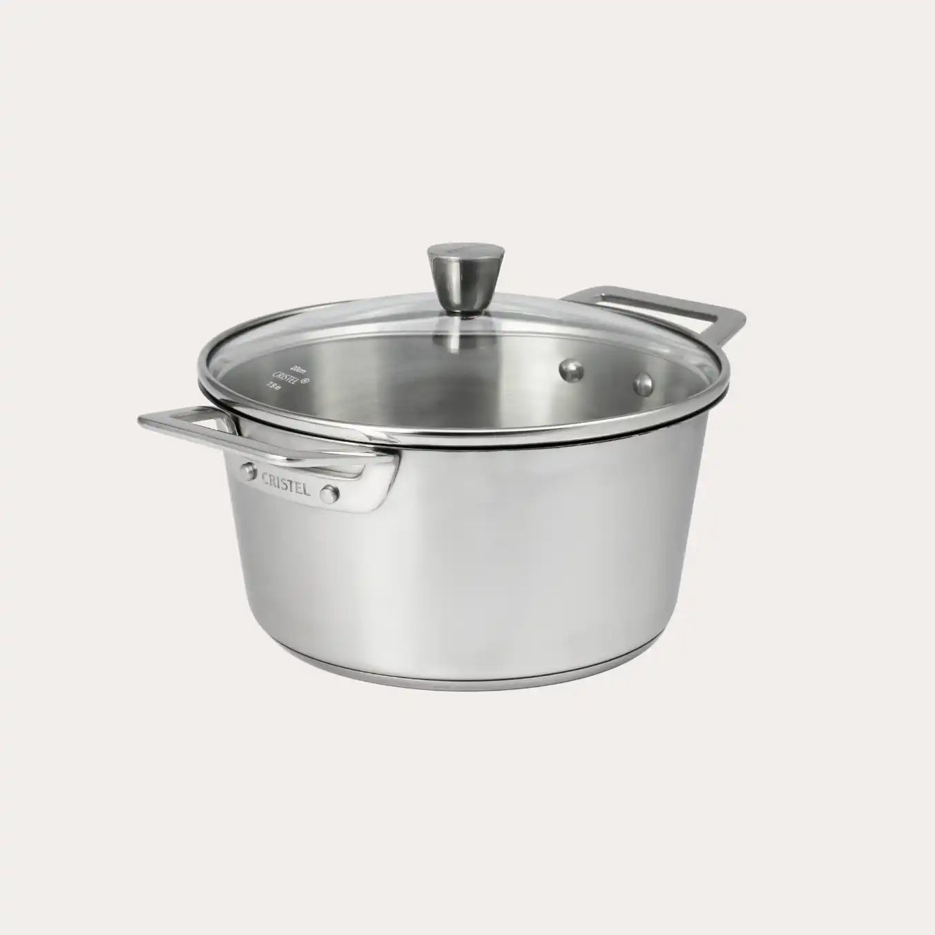 Brushed-finish stainless steel stewpot with rounded glass lid and polished handles from CRISTEL USA’s 1826® collection.