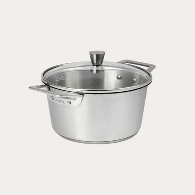 Brushed-finish stainless steel stewpot with rounded glass lid and polished handles from CRISTEL USA’s 1826® collection.