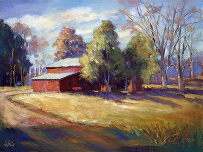 Syler's Barn canvas print showing a stylized barn with land and sky, framed in brown wood