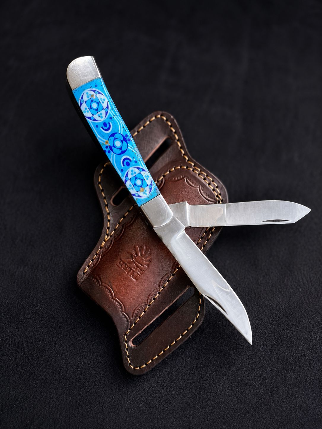 Titan "Zellige Tile" folding knife with turquoise mosaic resin handle and hand-tooled leather belt sheath