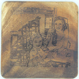 Square East Indian walnut coaster with a laser-engraved portrait of a smiling woman and child at a table, showing wood grain around the image.