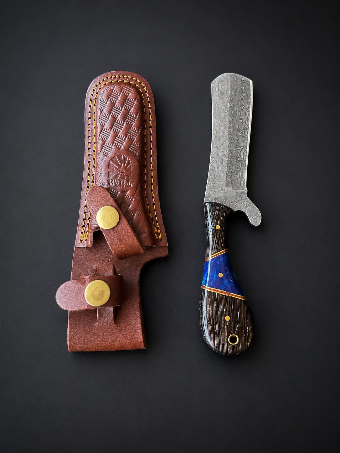 Titan "Malachite Range" Bull Cowboy Cutter showing damascus steel blade and wenge handle with malachite inlay alongside engraved Western leather sheath