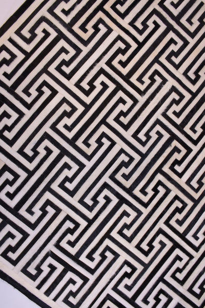T Model – Maze-Inspired Cowhide Patch Rug by Homelosophy