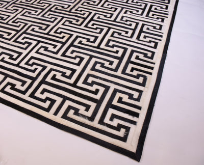 T Model – Maze-Inspired Cowhide Patch Rug by Homelosophy