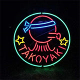 Neon sign with a red octopus wearing a blue headband, surrounded by a green circle and two yellow star shapes, with the word TAKOYAKI in red below.
