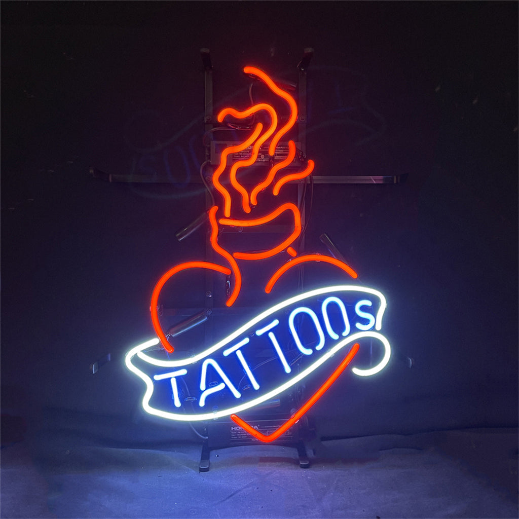 Lit Tattoos Neon Sign glowing in a dark interior space