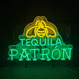 Neon sign with a yellow bee above green glowing text spelling 'TEQUILA PATRÓN' on a dark background.