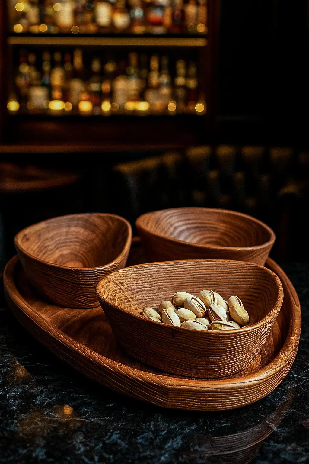Set of handcrafted wooden nut bowls with tray showing natural wood grain and sandblasted texture
