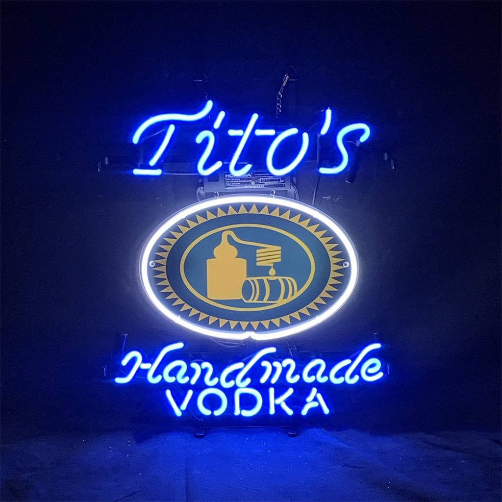 Blue Tito's Handmade Vodka Neon Sign Light glowing against dark background