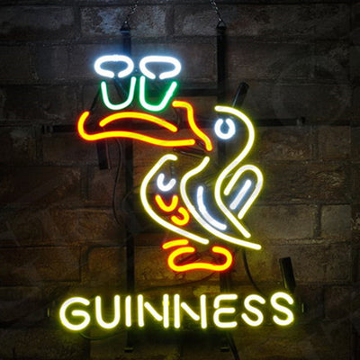 Toucan Bird Guinness Neon Signs Light illuminating in vibrant neon colors on a metal grid backing