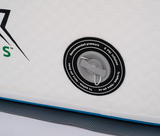 Close-up of a gray inflation valve with black round base and white text indicating 8 PSI recommended pressure on a white inflatable surface with a blue edge.