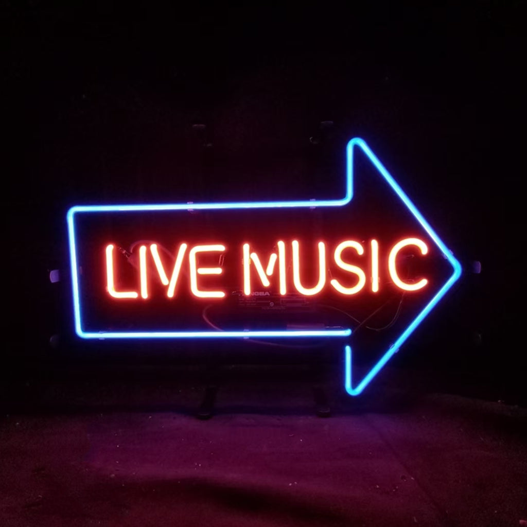 Neon sign with red text 'LIVE MUSIC' inside a bright blue right-pointing arrow on a dark background