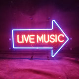 Live Music with Right Arrow Neon Sign glowing indoors, mounted on metal grid backing