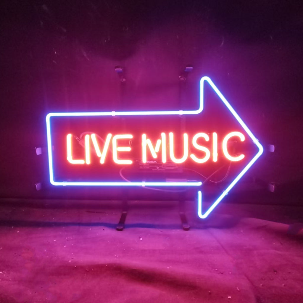 Live Music with Right Arrow Neon Sign glowing indoors, mounted on metal grid backing