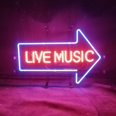 Live Music with Right Arrow Neon Sign glowing indoors, mounted on metal grid backing