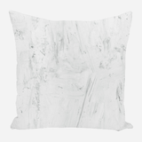 Square pillow with a white abstract textured pattern featuring subtle gray brushstroke details creating a soft, painterly effect.