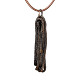 Ulvaxa pendant necklace by Versiliy showing organic, hand-shaped pendant on natural leather cord