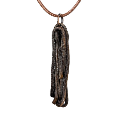 Ulvaxa pendant necklace by Versiliy showing organic, hand-shaped pendant on natural leather cord