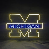 Neon sign with a large yellow outline letter M and the word 'MICHIGAN' in blue neon across the center on a dark background.