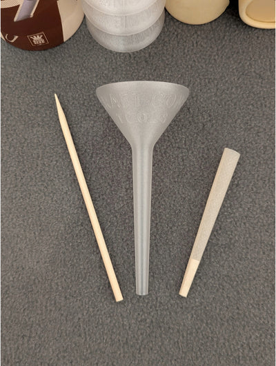 King Craft Cone Filler & Packing Tool Kit showing filler, packing stick, and king-sized cone in clear and black colors