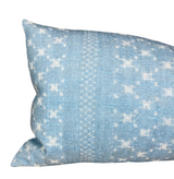 Rectangular pillow cover in soft azure blue with a subtle, irregular white woven pattern and a vertical textured stripe near the center.
