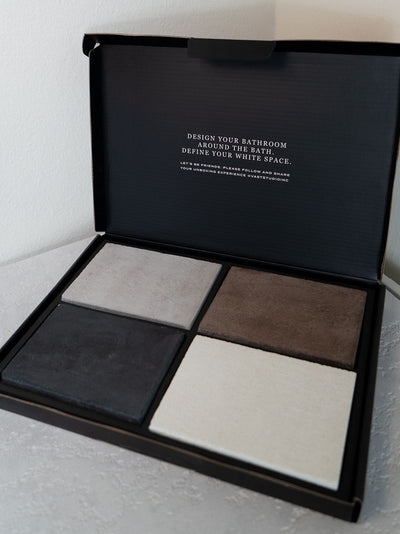 VAST Studio Finish Samples box showing four concrete finish samples in black, gray, bone, and earth brown