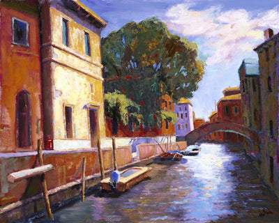 Venice Canal Artist Enhanced Canvas Print showing a softly detailed urban canal scene with moored boats and reflected buildings