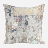 Square pillow with a distressed abstract pattern in muted tones of beige, gray, and hints of blue and yellow, resembling worn vintage textures.