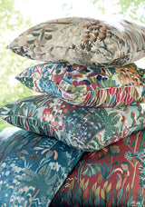 Stack of five decorative pillows featuring vibrant floral and botanical patterns in varying colors, including beige, multicolor, blue, and red tones, arranged on a light background.