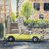 Side view of a yellow Triumph Spitfire convertible parked next to stone stairs and a tan brick building with greenery in an urban setting, watercolor style.