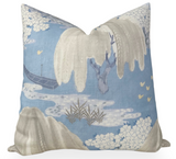 Square pillow with soft blue background featuring a willow tree branch with hanging cream-colored leaves and clusters of white flowers, accented by abstract water and bridge design.