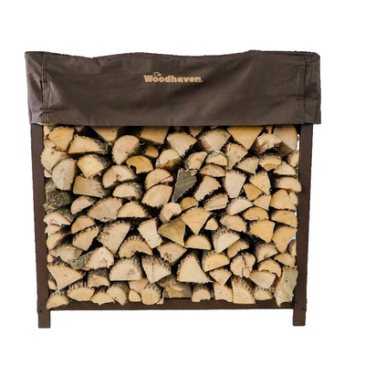 Woodhaven 3 ft Firewood Rack with seasoning cover in black finish holding stacked firewood