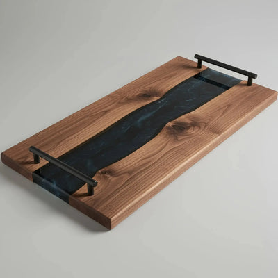 Live edge black walnut charcuterie board with smoky black epoxy resin river and matte black cylindrical handles, handcrafted and sealed with food-safe oil.