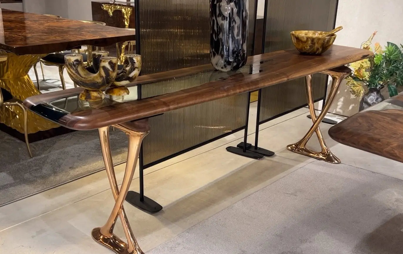 Handcrafted resin console table with walnut wood and epoxy resin top, featuring rose gold aluminum legs from Osso Collection