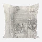Square pillow with textured abstract design in shades of gray and white, featuring horizontal and vertical strokes creating a layered effect.