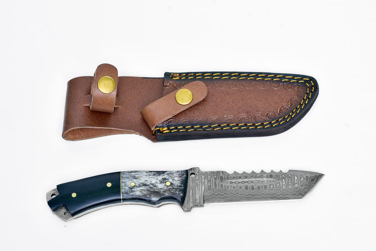 TD-039XM Damascus Steel Tanto Knife with dyed bone handle and layered Damascus blade on a dark textured background
