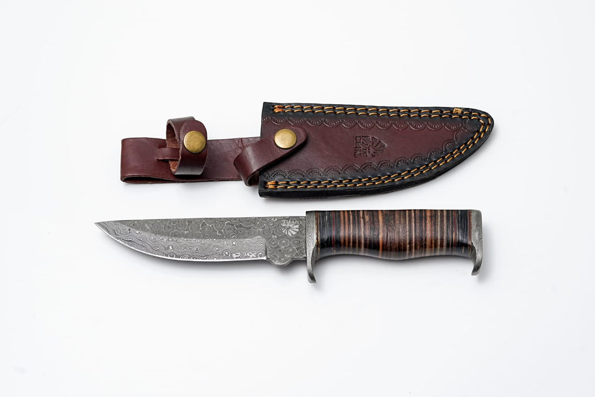 DAMASCUS KNIFE/ Titan/ Camp/ Hunting Knife with leather handle and diamond wood spacers displayed on a wooden surface