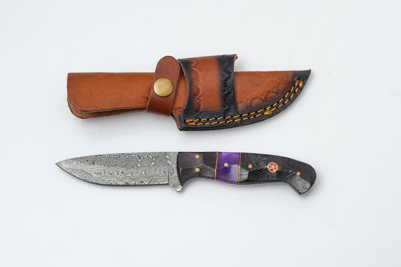 Damascus Steel Fixed Blade Knife with Wenge Wood and Purple Resin Handle - TK-419 resting on a wooden surface