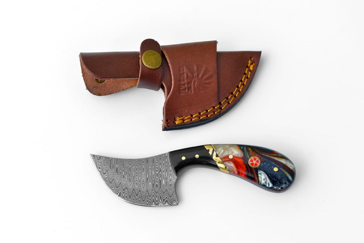 Damascus Curve Utility Knife TK-460 showing its curved blade, multicolor acrylic handle, brass accents, and leather sheath.