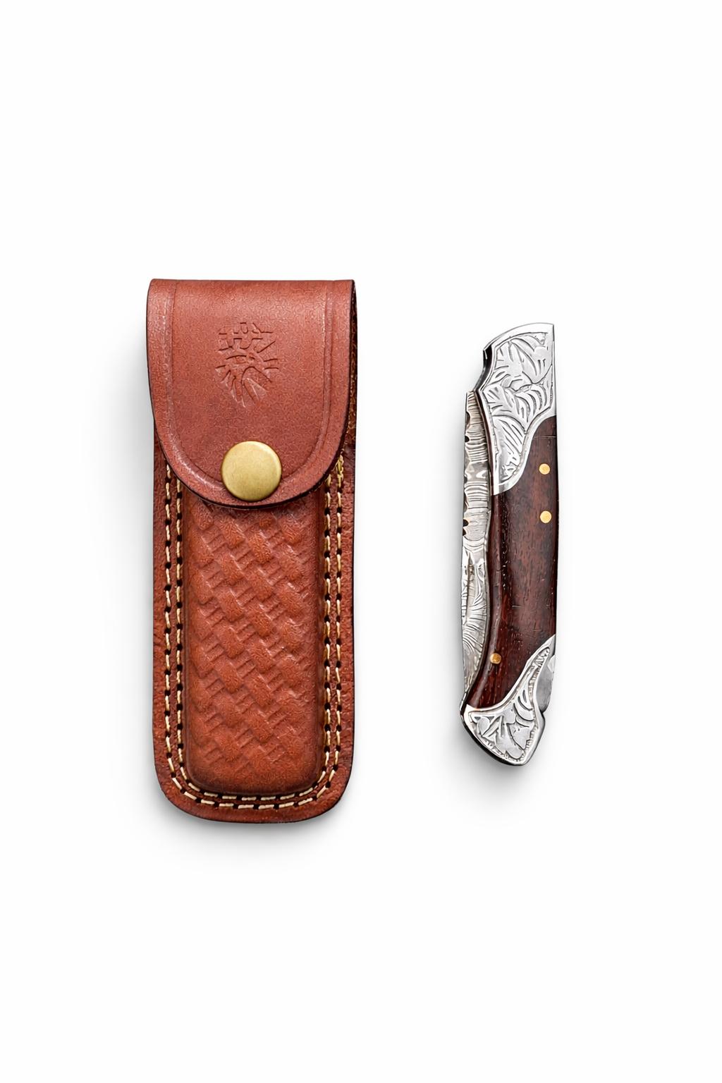 Titan Ironcrest Damascus Folding Knife with Damascus steel blade, dark hardwood handle, steel bolsters, and leather sheath