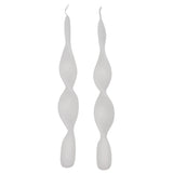 Pair of white candles with a twisted, spiral design tapering to a point at the top and rounded bases, shown side by side against a white background.