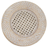 Set of four white rattan chargers arranged on a table with plates and tableware